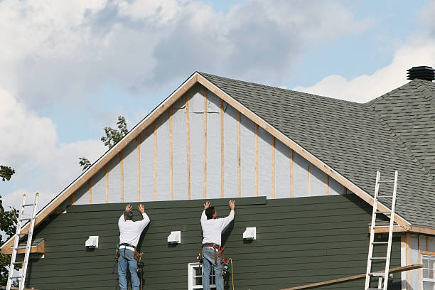 Professional Vinyl Siding technician working in South Boston, MA